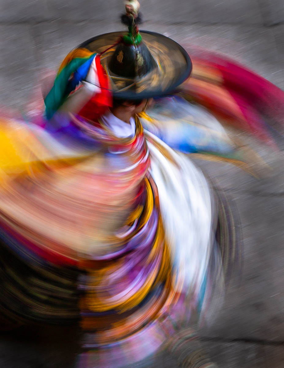 Black Hat Dancer Whirls in motion.