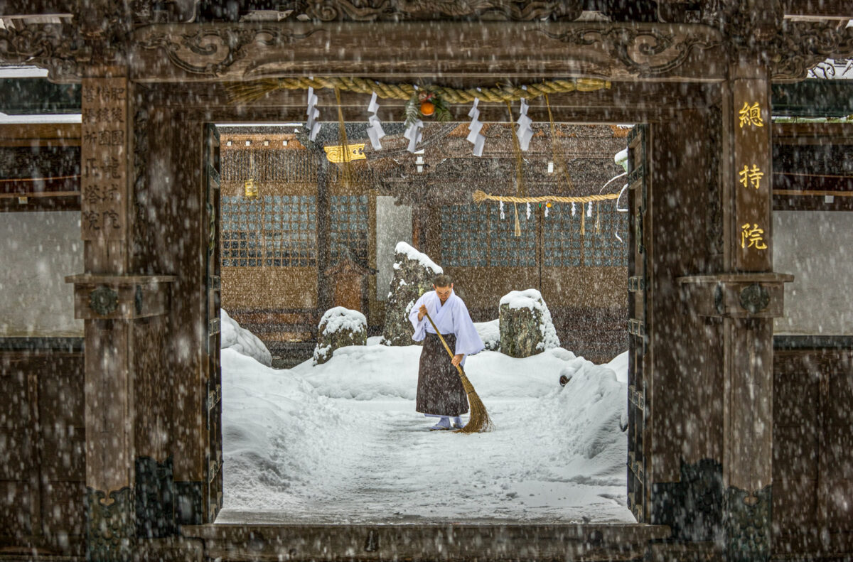 A Buddhist monk sweeping a temple, Koyasan.