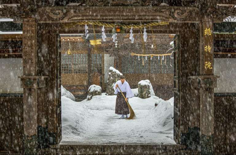 A Buddhist monk sweeping a temple, Koyasan.